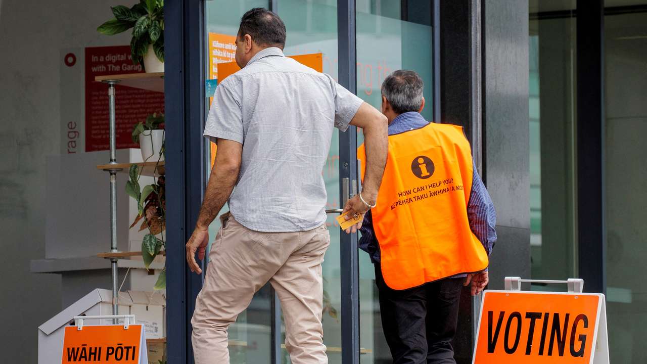 FILE PHOTO: People head to the polls to vote in the general election in Auckland
