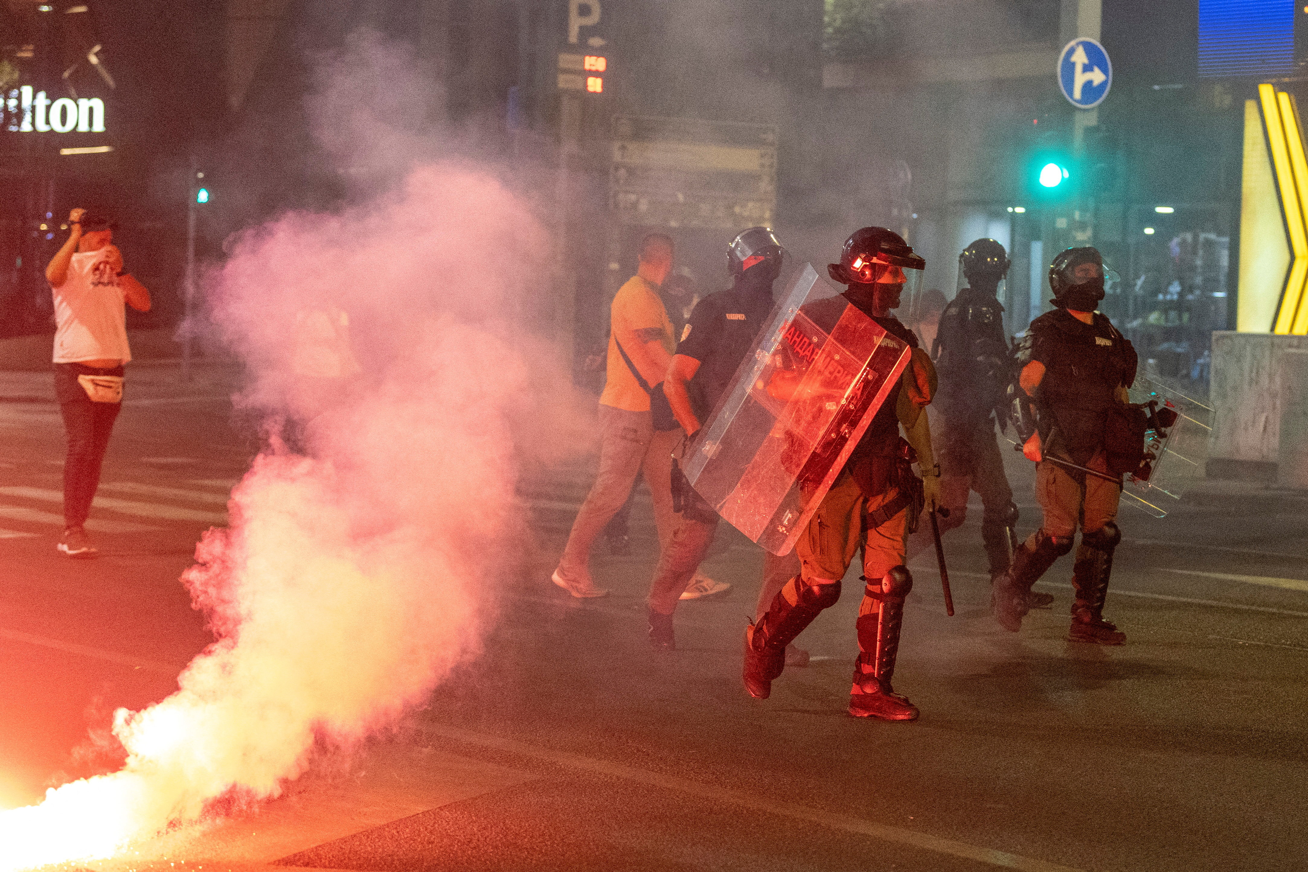 Serbia's police intervene to end standoff between ruling party supporters and anti-government protesters in Belgrade