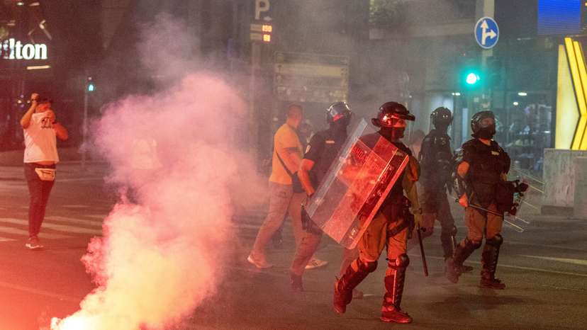Serbia's police intervene to end standoff between ruling party supporters and anti-government protesters in Belgrade