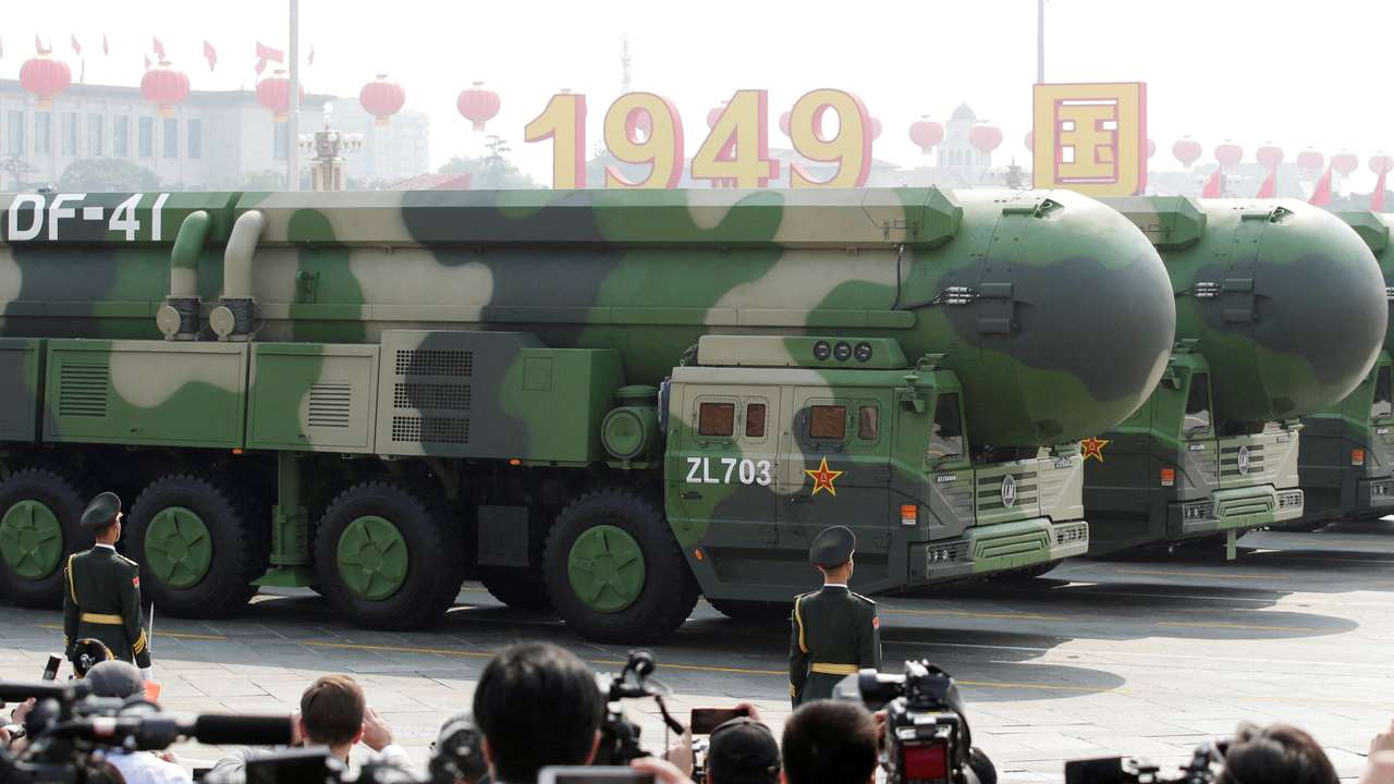 FILE PHOTO: Military vehicles carrying DF-41 intercontinental ballistic missiles travel past Tiananmen Square during the military parade marking the 70th founding anniversary of People's Republic of China