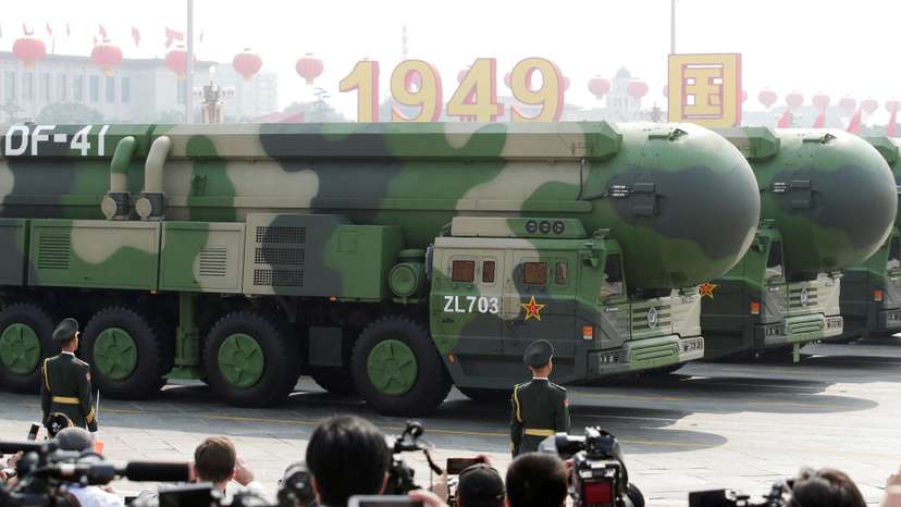 FILE PHOTO: Military vehicles carrying DF-41 intercontinental ballistic missiles travel past Tiananmen Square during the military parade marking the 70th founding anniversary of People's Republic of China