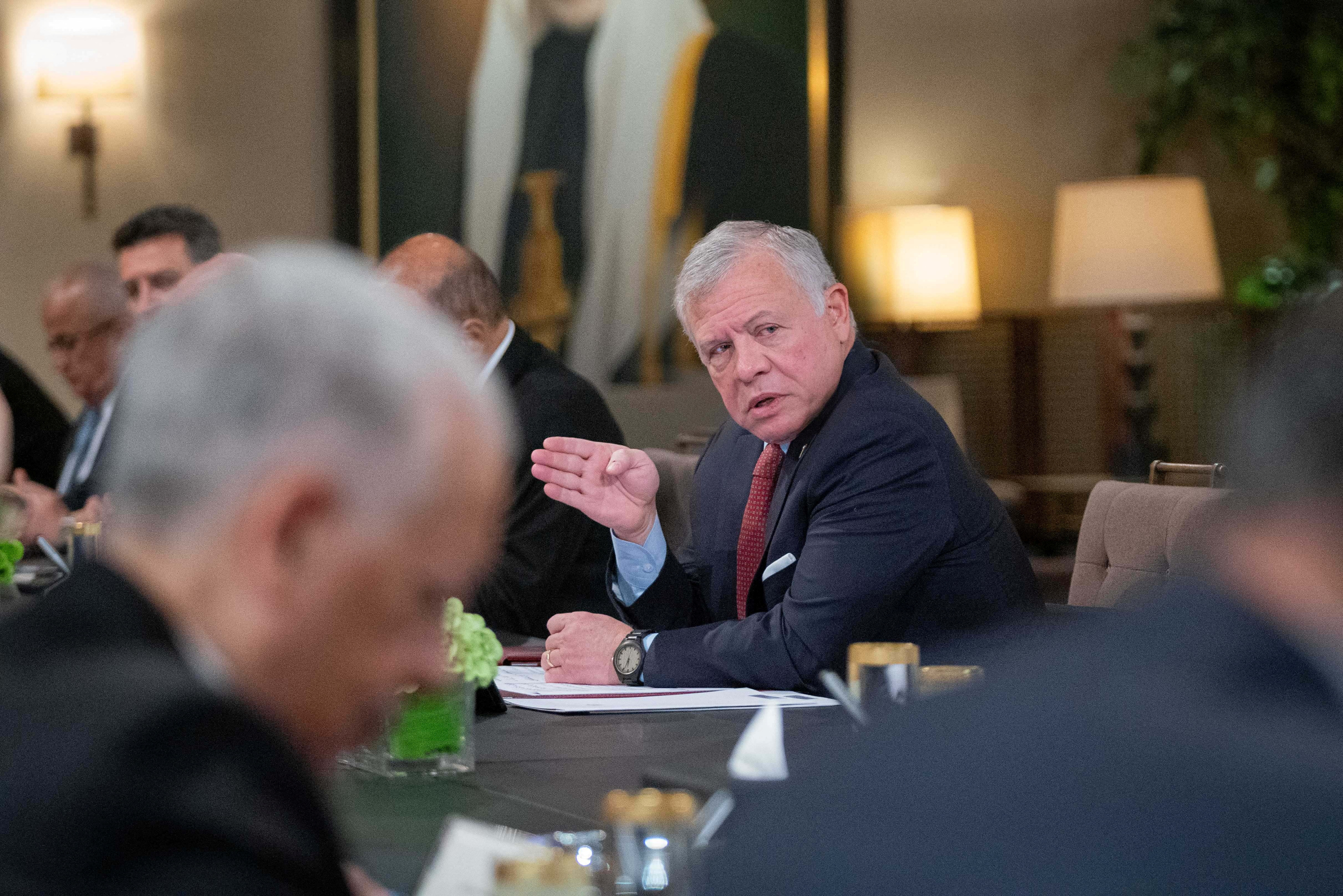 Jordan's King Abdullah II speaks during his meeting with officials in Amman