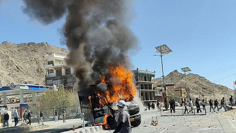 A vehicle is set on fire during a protest by locals demanding statehood for the federal territory and job quotas for local residents in Leh