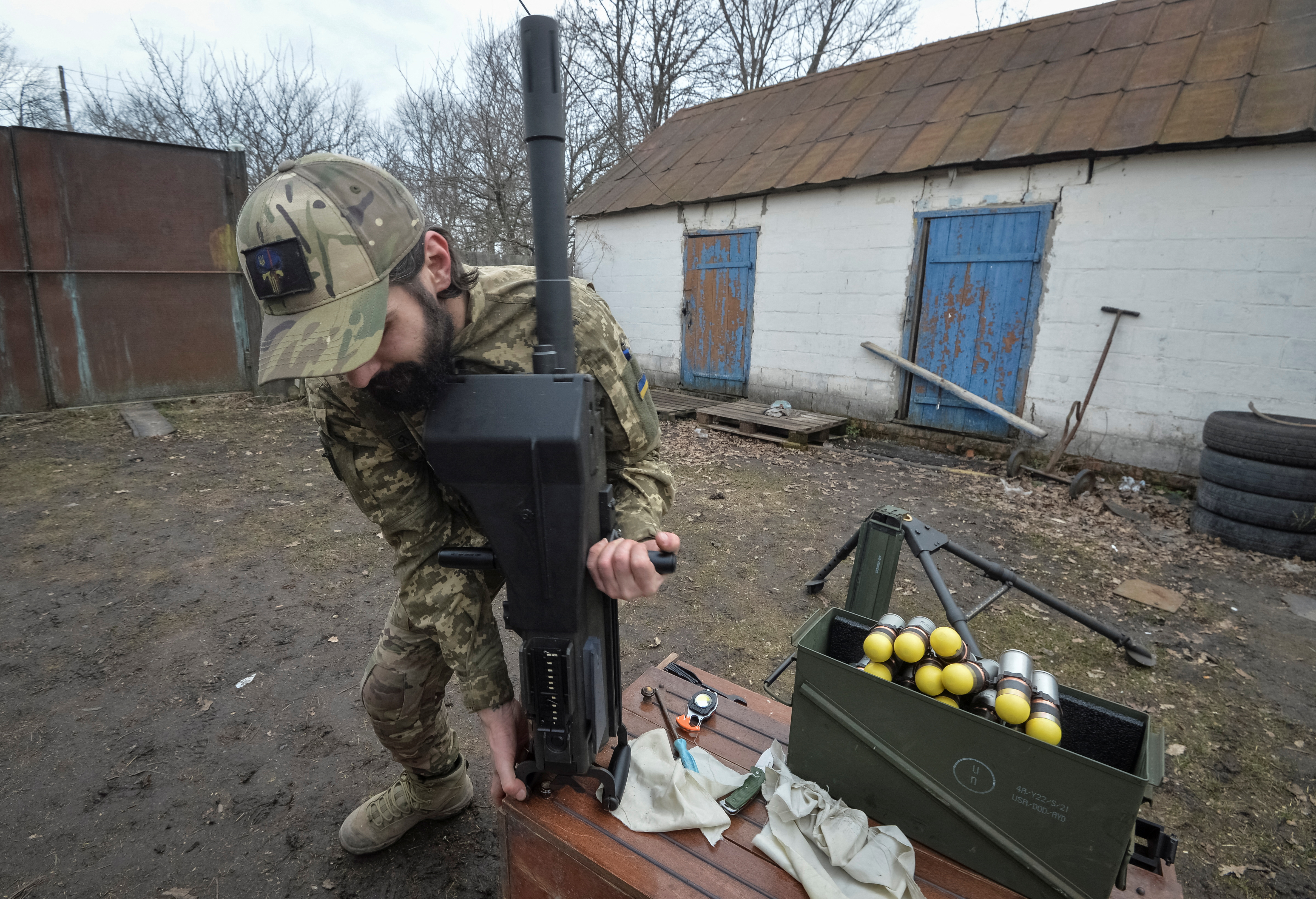 FILE PHOTO: A serviceman of the Ukrainian Armed Forces works with a Mk 19 U.S. made automatic grenade launcher near the frontline town of Vovchansk