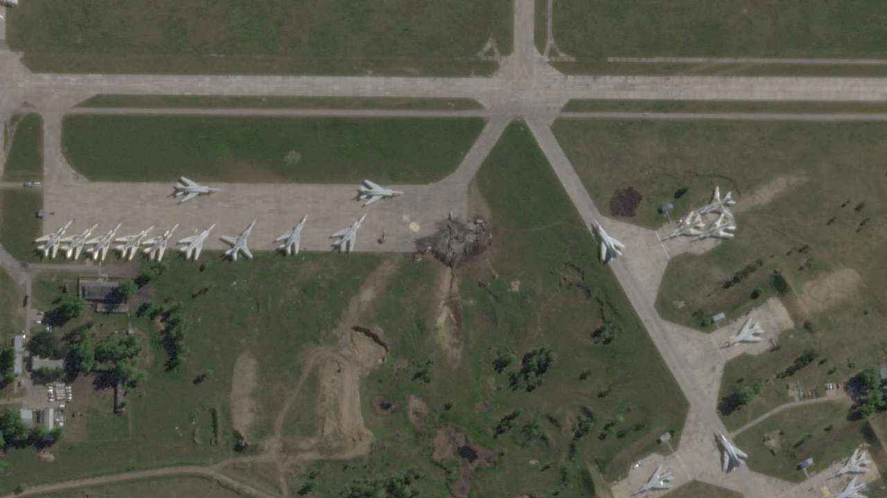 FILE PHOTO: Satellite view shows damaged planes and tarmac at Russian Belaya airfield