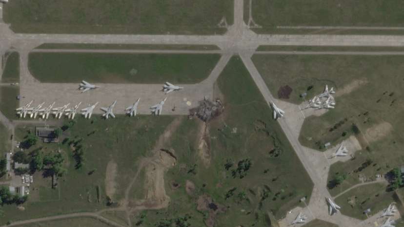 FILE PHOTO: Satellite view shows damaged planes and tarmac at Russian Belaya airfield