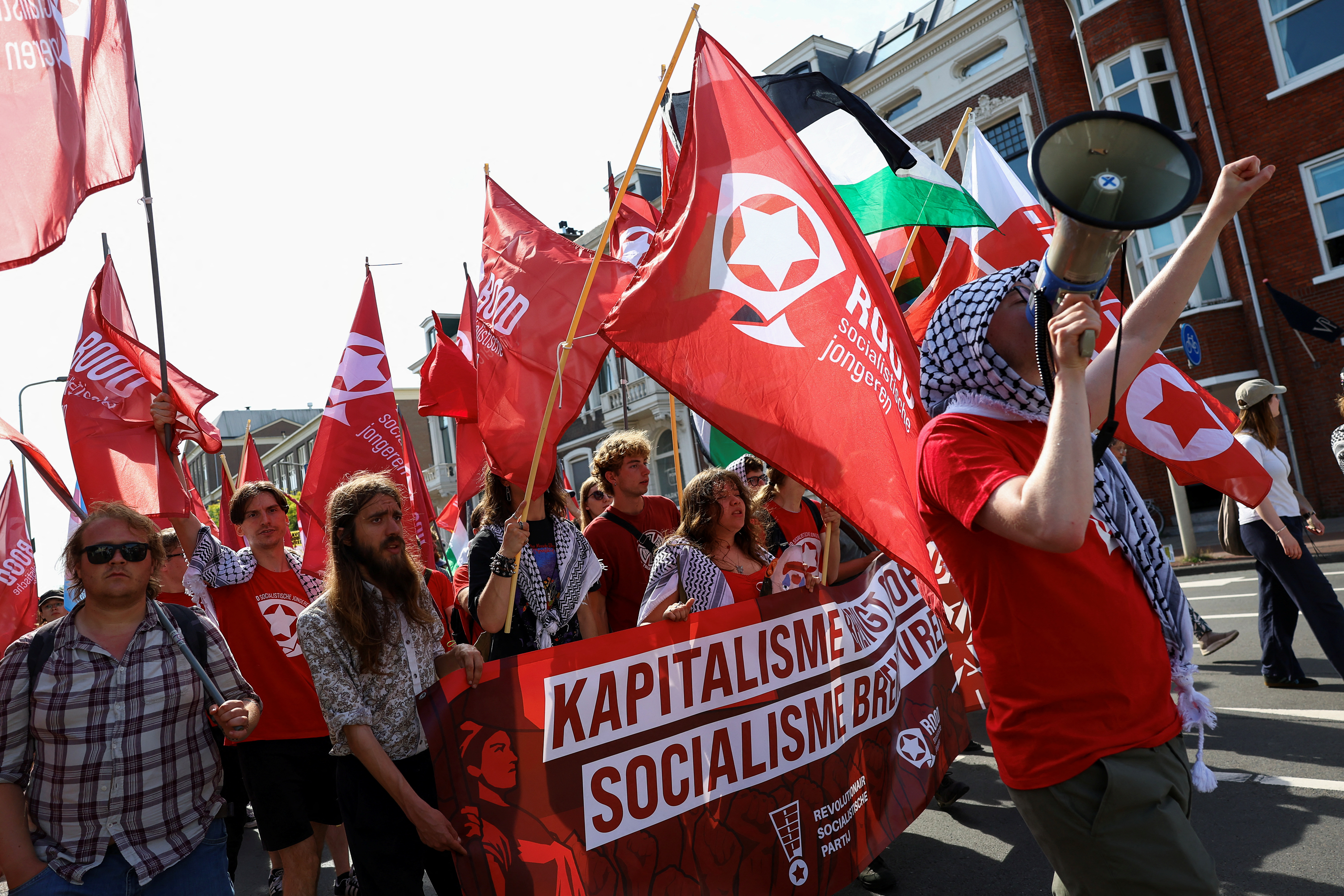 Demonstrators march against the upcoming NATO leaders' summit at The Hague