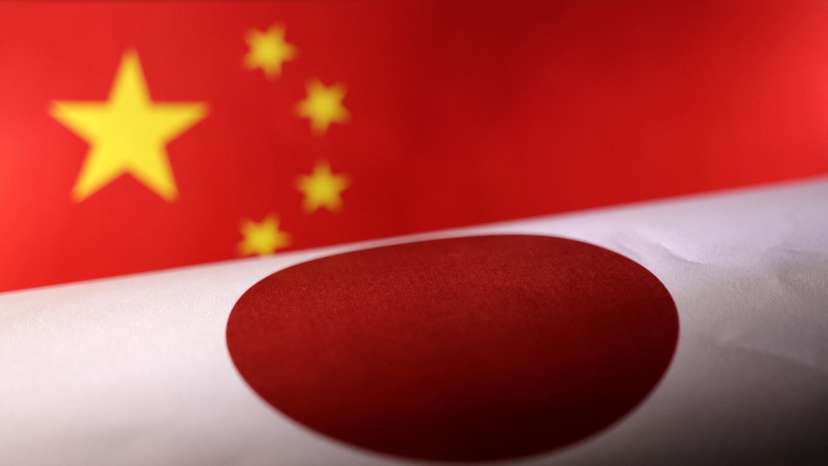 Illustration shows printed Chinese and Japanese flags