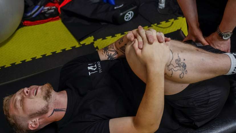 Ukrainian serviceman, who lost most of his left leg after being wounded by an anti-personnel mine, exercises at a rehabilitation centre in Kyiv