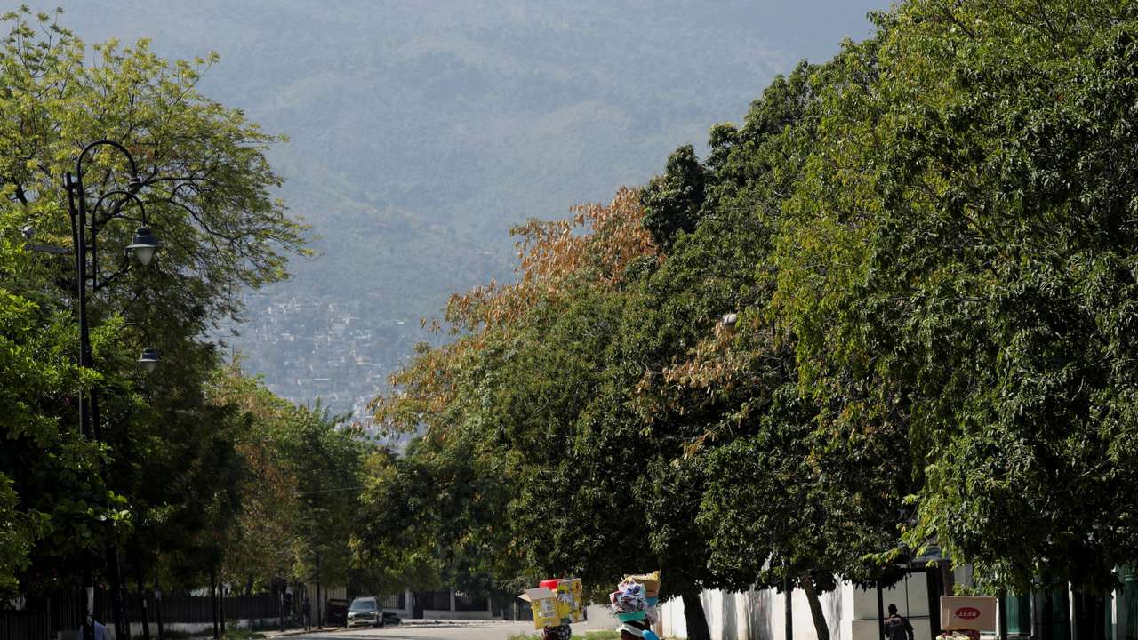 After prime minister pledges to step down, uneasy quiet in Haiti capital