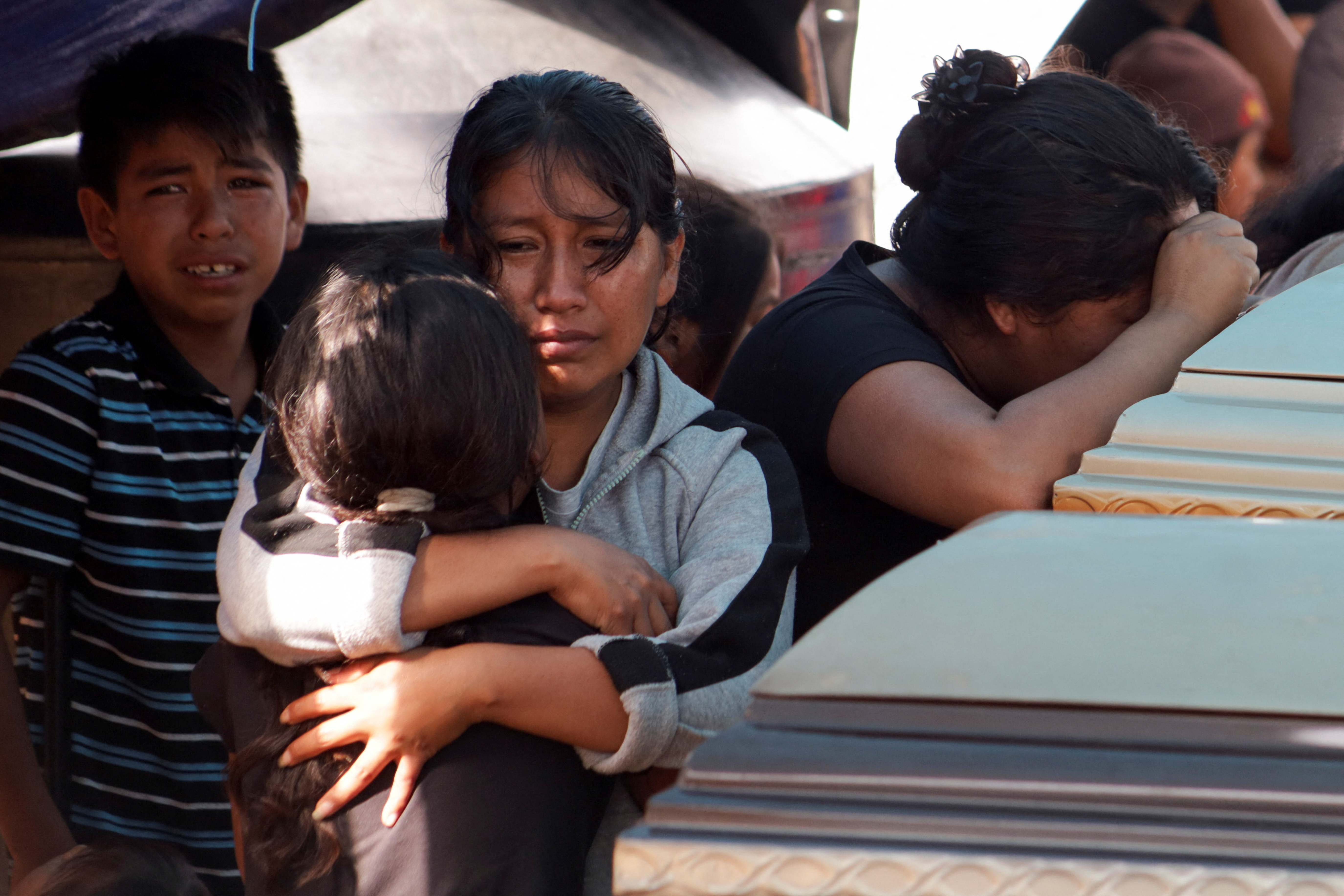 Relatives hold wake for some of the persons found dead in a van, in Chilpancingo