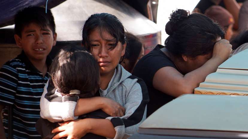Relatives hold wake for some of the persons found dead in a van, in Chilpancingo