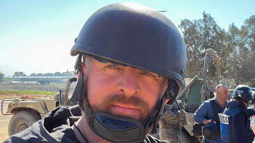 Reuters safety advisor Ryan Evans takes a selfie in Be'eri
