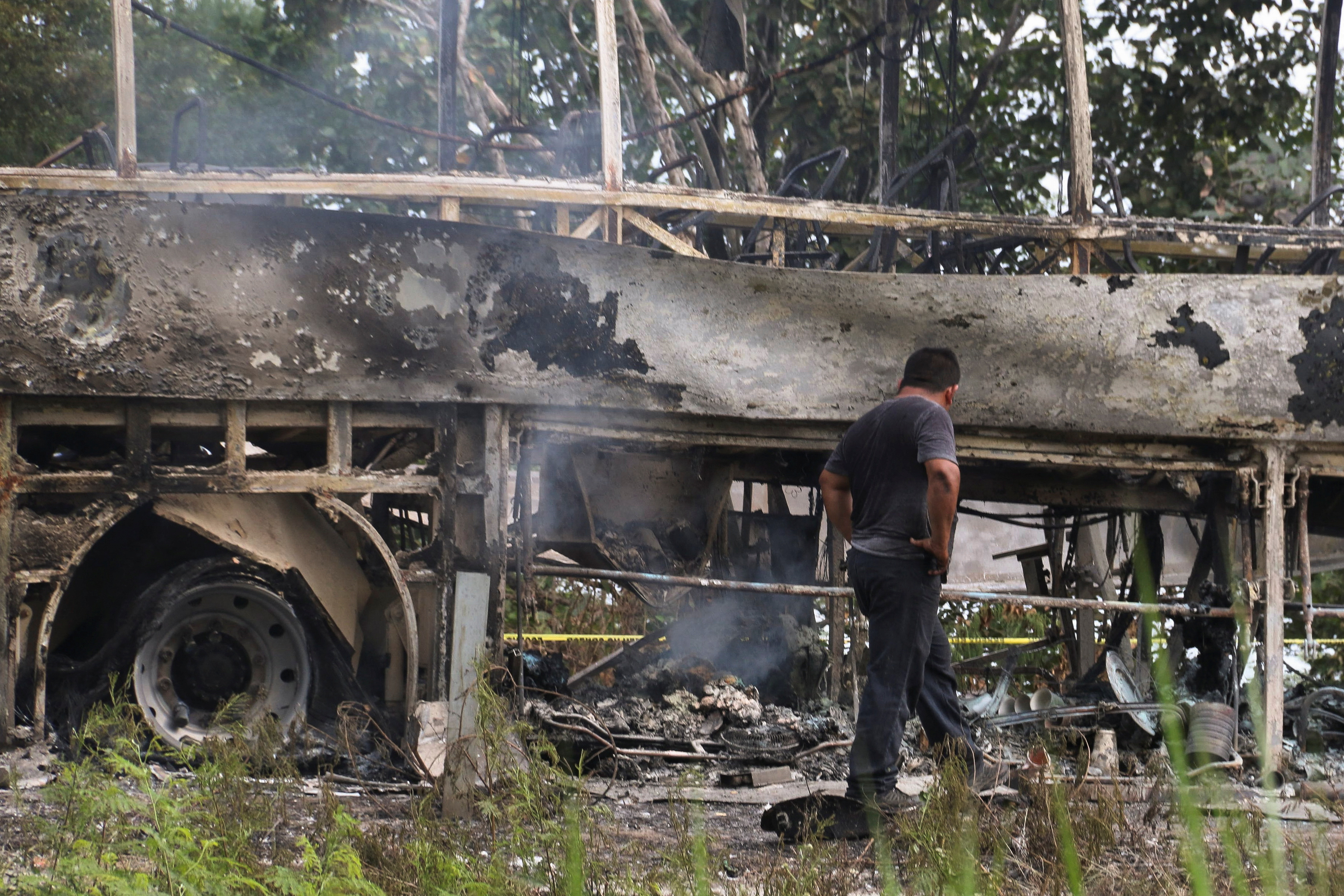 A burned bus is pictured after colliding with a trailer near Escarcega