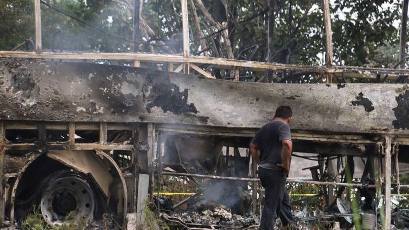 A burned bus is pictured after colliding with a trailer near Escarcega