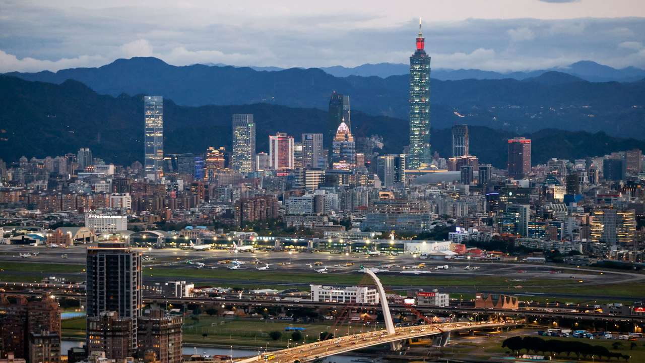 A general view shows Taipei city skyline, including the Taipei 101 skyscraper, with Songshan Airport in the foreground in Taipei