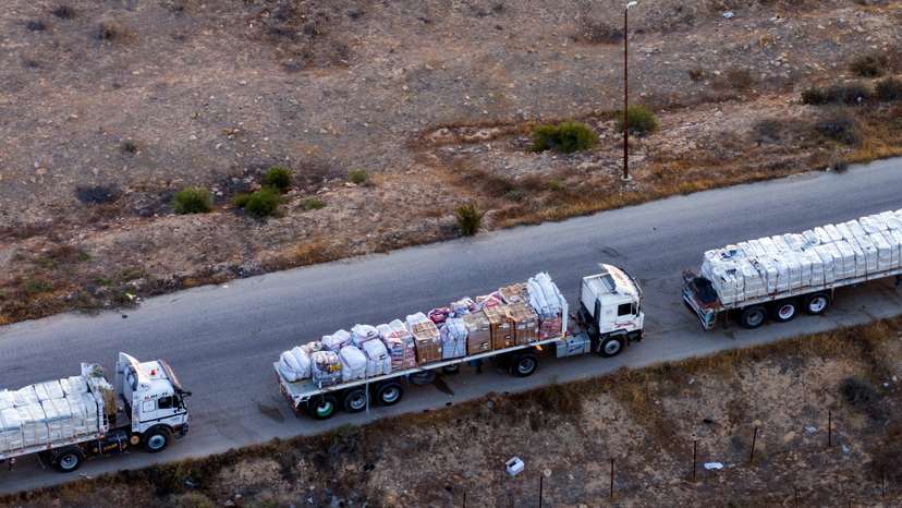 A drone picture of part of a line of trucks waiting on an Egyptian road along the border with Israel, near the Rafah border crossing with the Gaza Strip