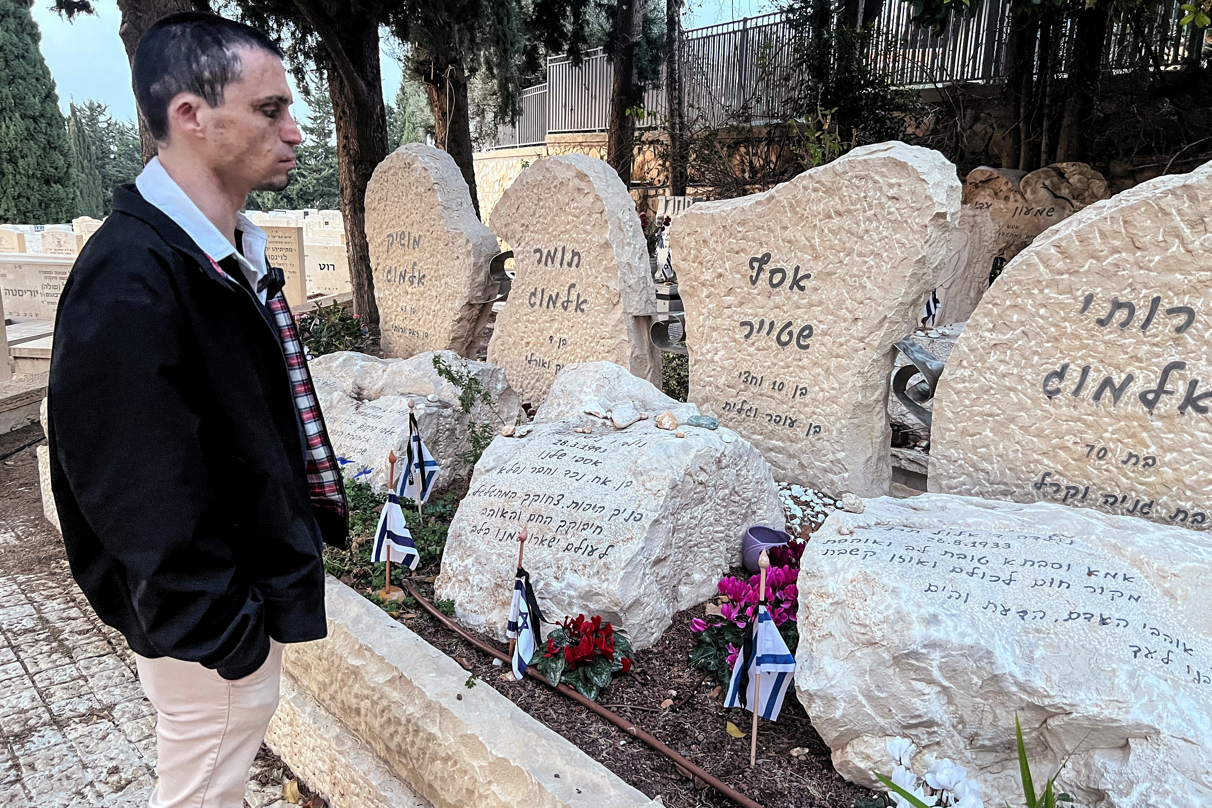 Oran Almog visits a memorial of the people killed in the Maxim restaurant suicide bombing, in Haifa
