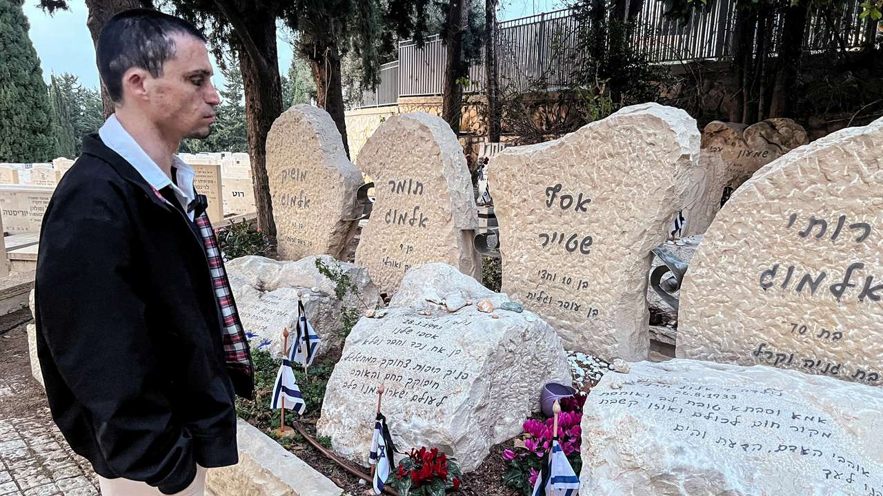 Oran Almog visits a memorial of the people killed in the Maxim restaurant suicide bombing, in Haifa