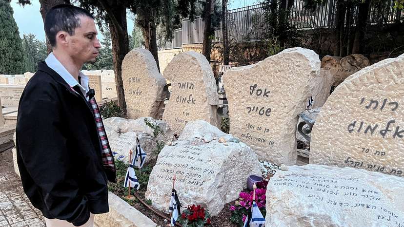 Oran Almog visits a memorial of the people killed in the Maxim restaurant suicide bombing, in Haifa