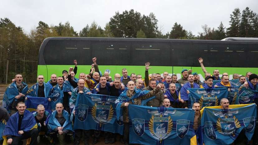 Ukrainian prisoners of war (POWs) gather after a swap at an unknown location in Ukraine