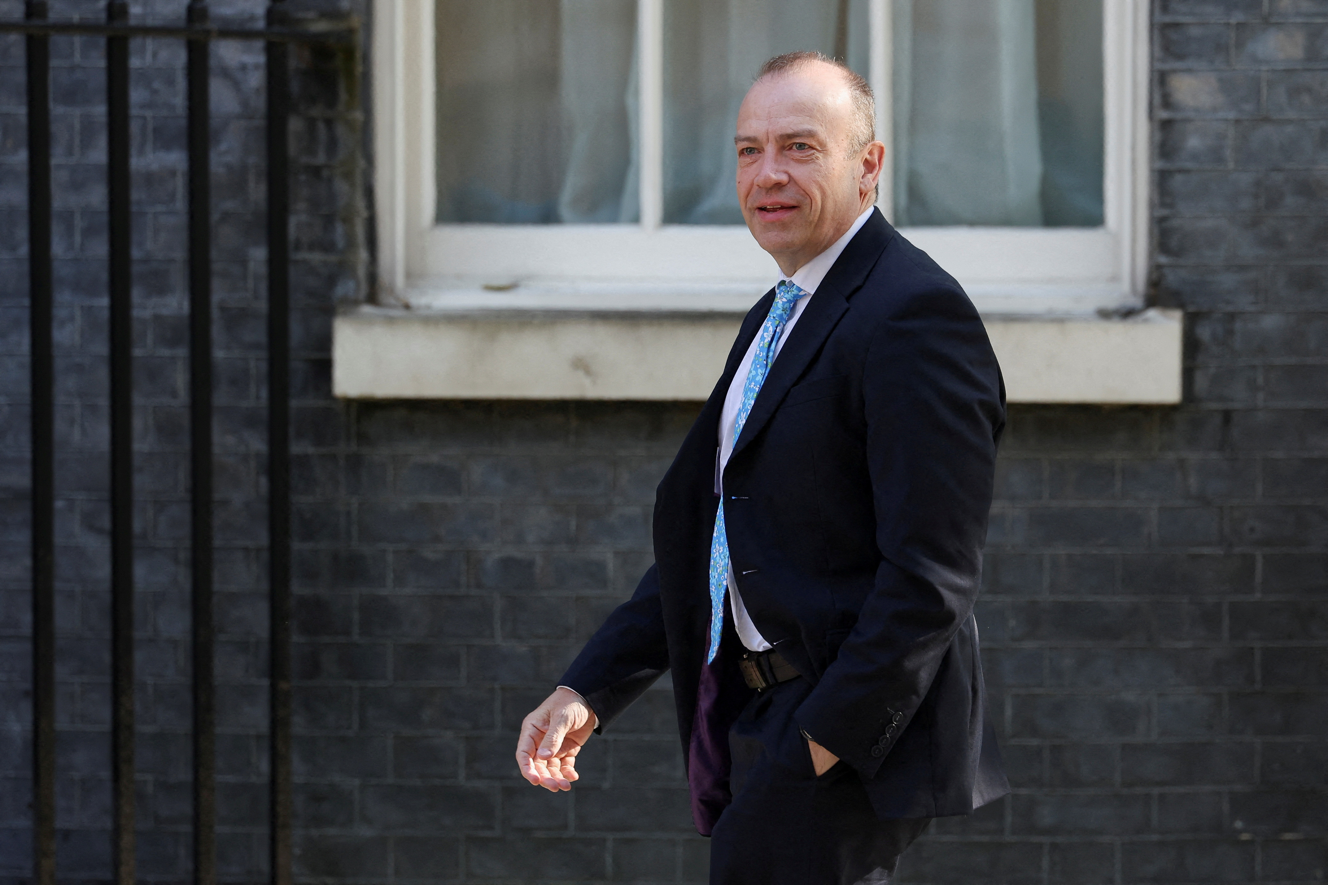 FILE PHOTO: Britian's Northern Ireland minister Chris Heaton-Harris at Downing Street in London