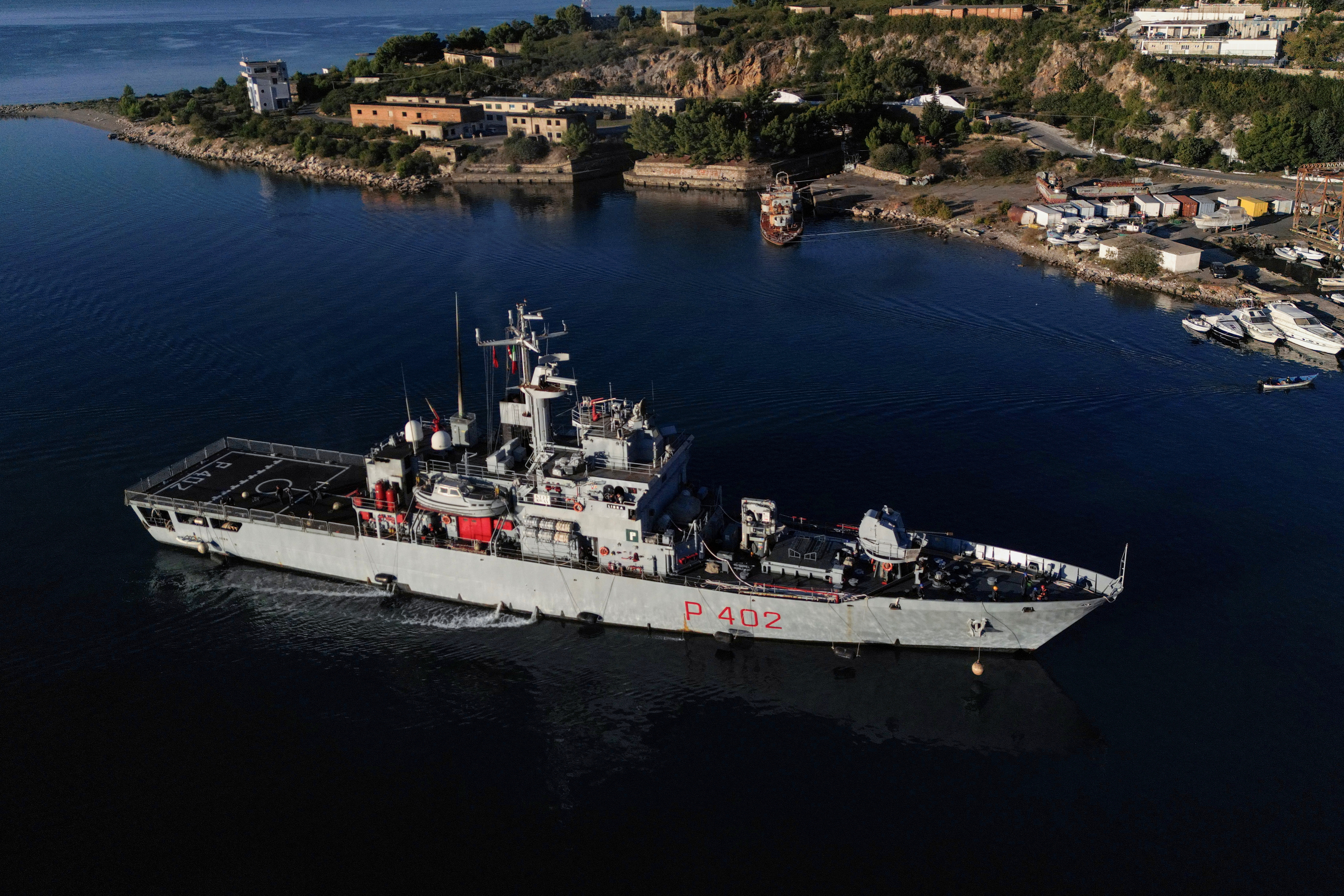 A drone view of the Italian navy ship Libra carrying migrants arriving in Shengjin