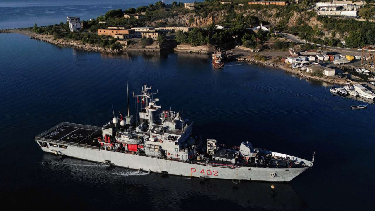 A drone view of the Italian navy ship Libra carrying migrants arriving in Shengjin