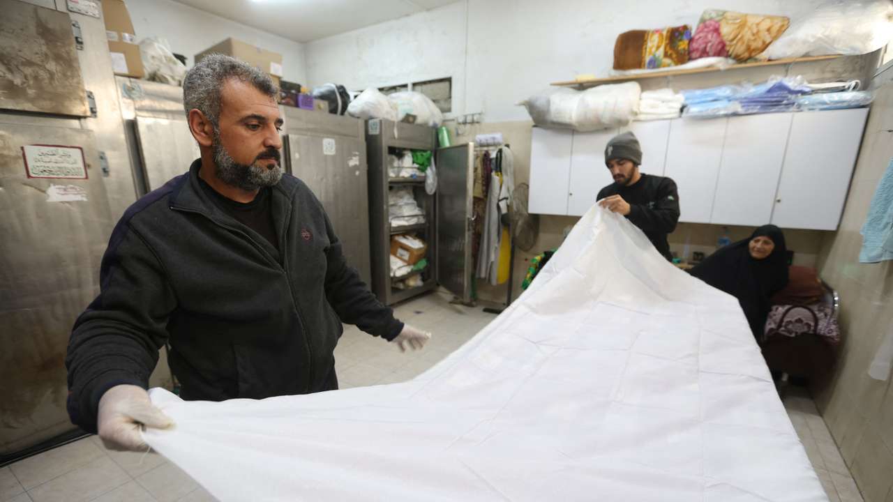 In Gaza, rows of white shrouds symbolize mounting civilian deaths
