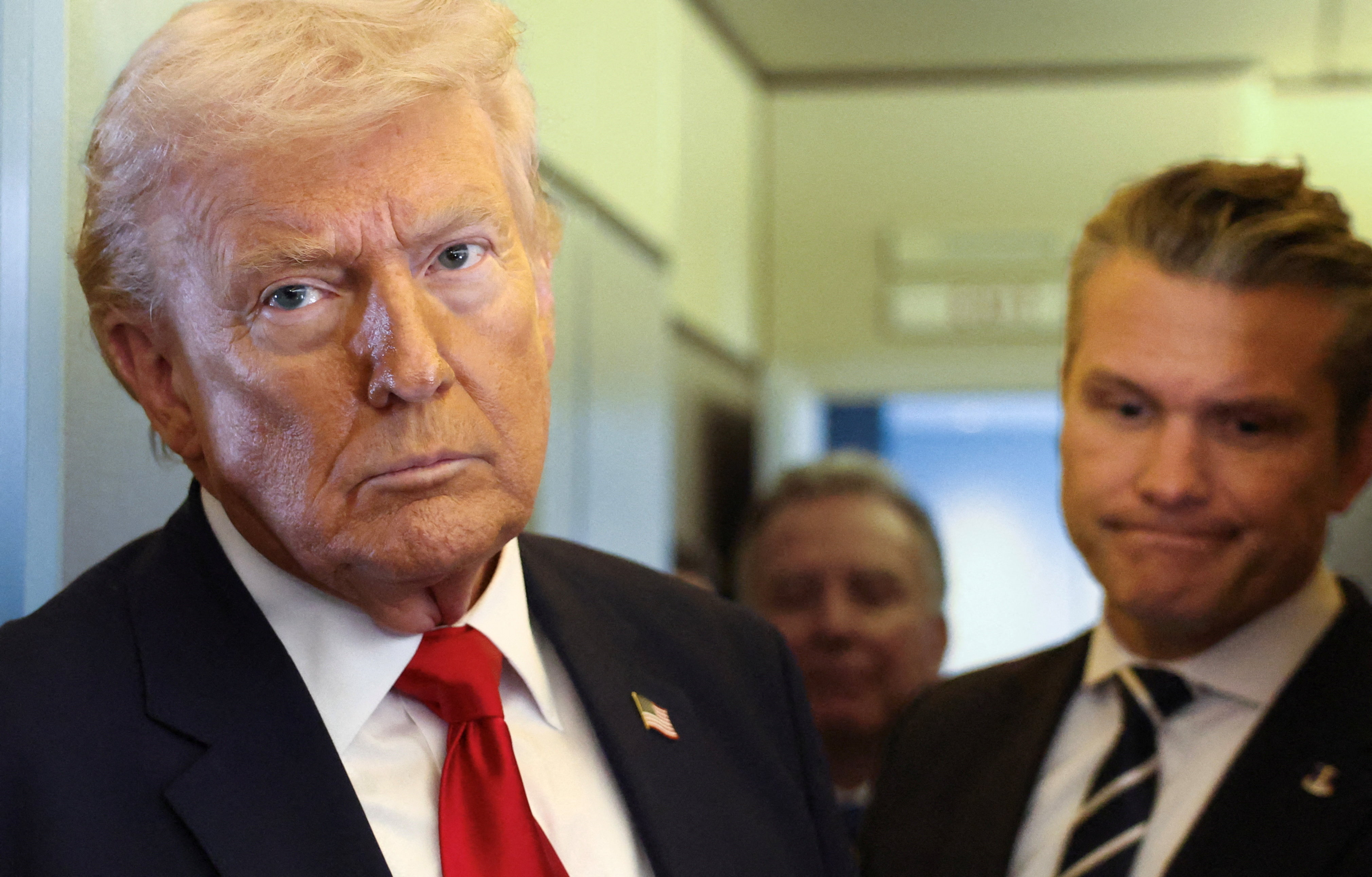 Trump speaks to reporters aboard Air Force One