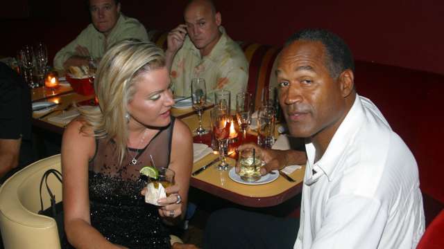 **FILE PHOTO** O.J. Simpson Has Passed Away. EXCLUSIVE Miami Beach, FL 6-13-2002 OJ Simpson is back with girlfriend Chri