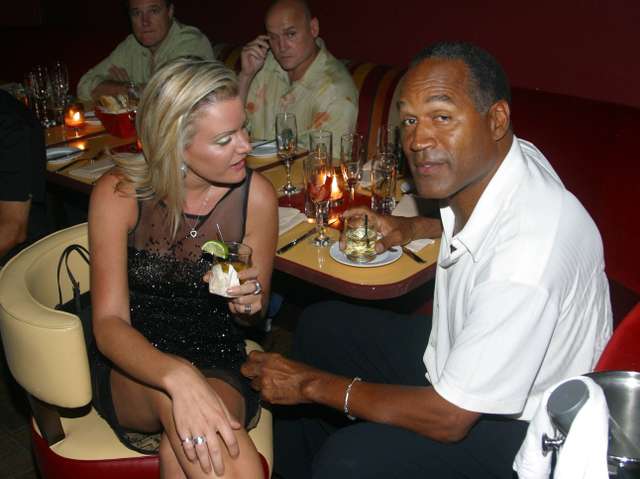 **FILE PHOTO** O.J. Simpson Has Passed Away. EXCLUSIVE Miami Beach, FL 6-13-2002 OJ Simpson is back with girlfriend Chri