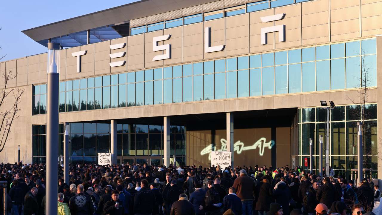Workers of Tesla's plant protest against an arson attack that has caused a major power outage at Gigafactory in Gruenheide