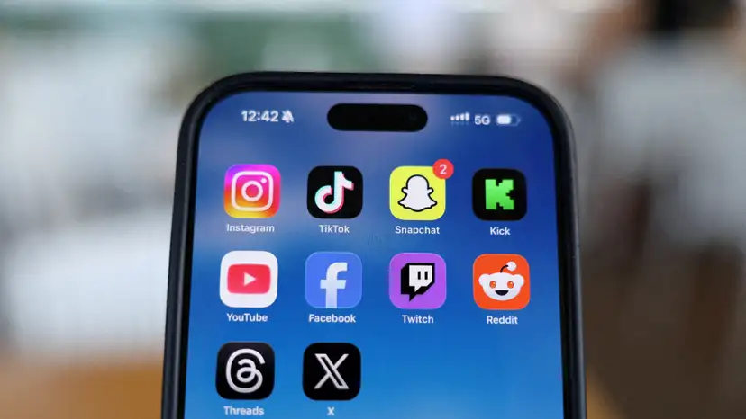 FILE PHOTO: Social media apps are displayed on a mobile phone