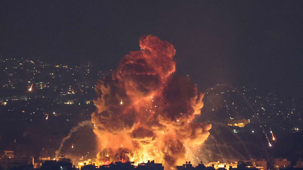 Smoke and flames rise in Beirut's southern suburbs, after Israeli air strikes, amid ongoing hostilities between Hezbollah and Israeli forces, as seen from Sin El Fil