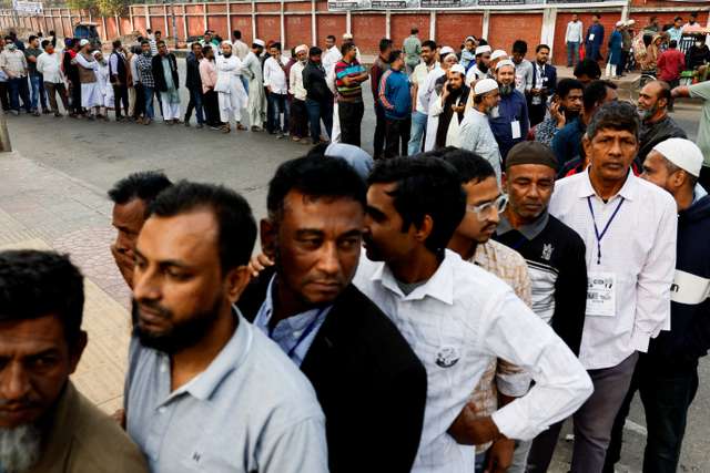 Voters stand in the queue to cast their vote at a polling station during the 13th general election in Dhaka, Bangladesh, February 12, 2026. REUTERS/Mohammad Ponir Hossain