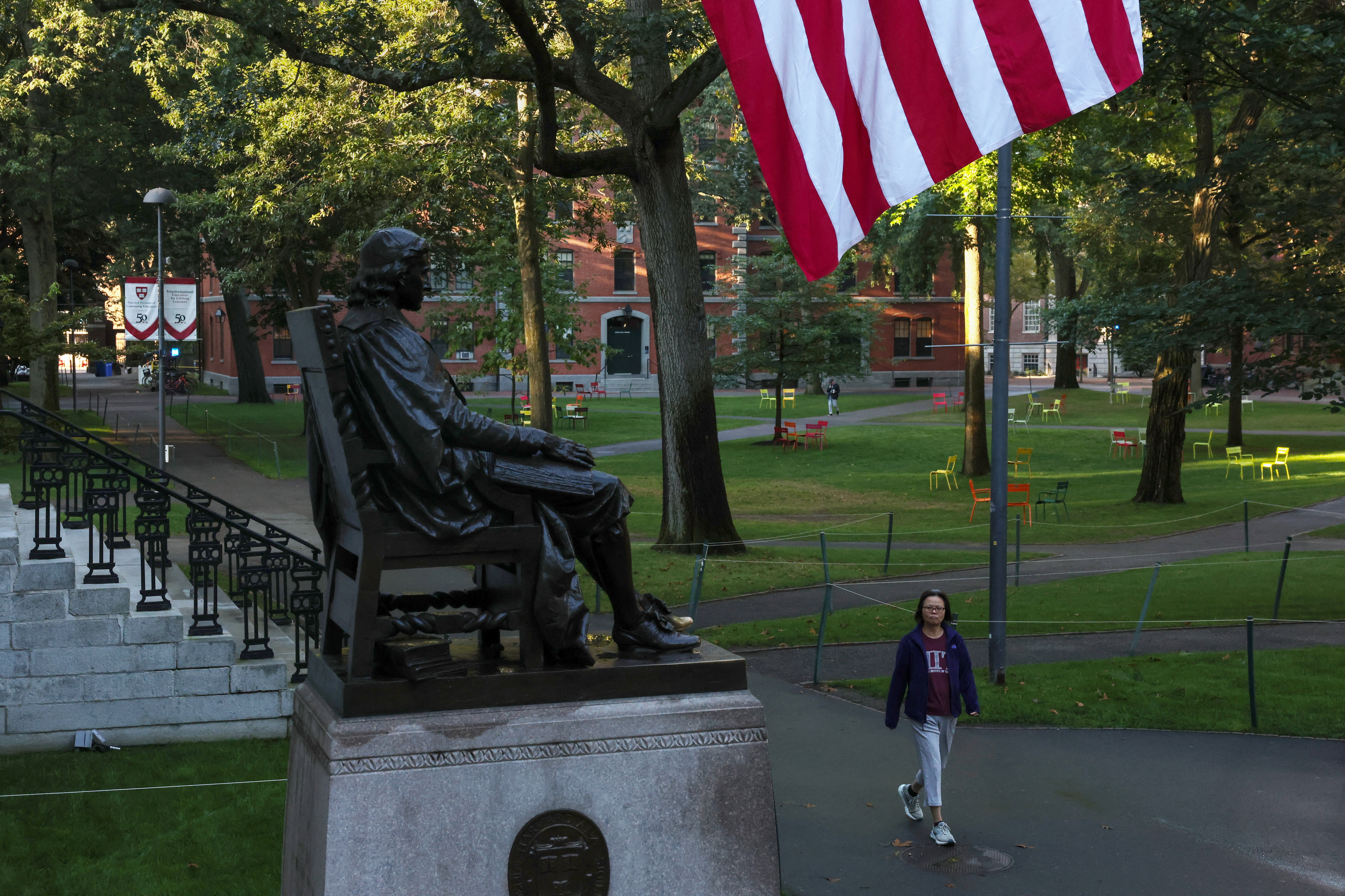 A woman walks on campus at Harvard University in Cambridge, Massachusetts