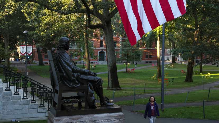 A woman walks on campus at Harvard University in Cambridge, Massachusetts