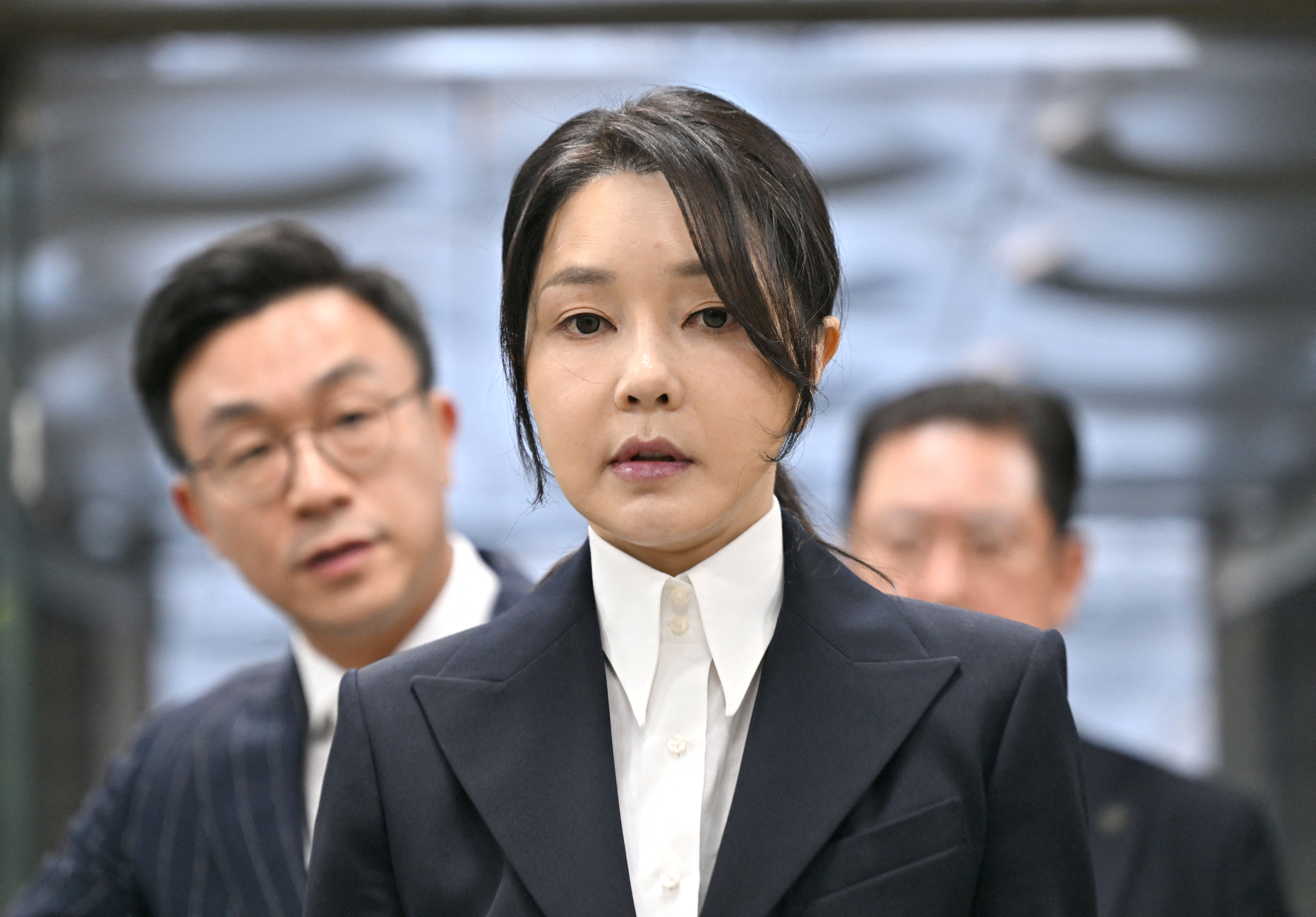 South Korea's former first lady Kim Keon Hee arrives at a court to attend a hearing to review her arrest warrant, in Seoul