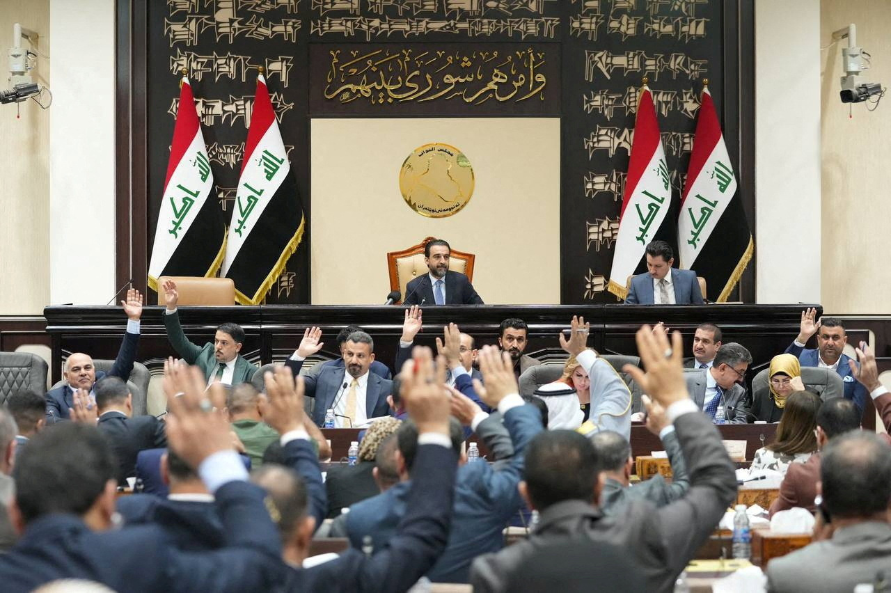 FILE PHOTO: Iraqi lawmakers attend a parliamentary session to vote on the federal budget at the parliament headquarters in Baghdad