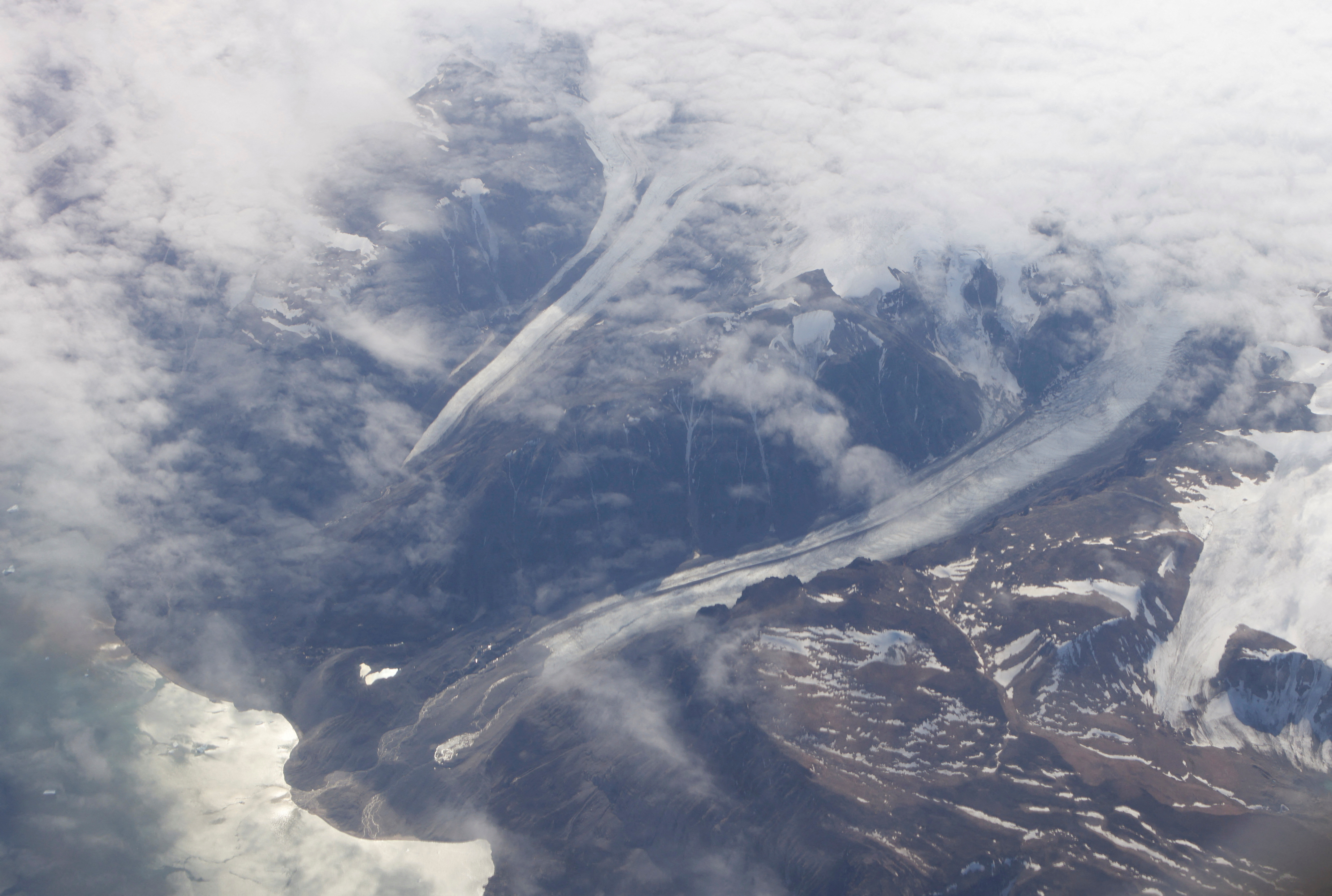 FILE PHOTO: Valleys cut by glaciers of the Greenland Ice Sheet along the mountains of Greenland