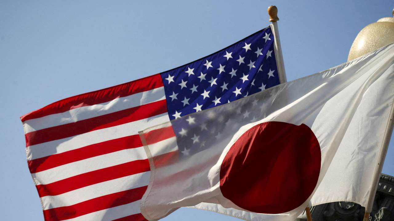 FILE PHOTO: Japan and U.S. flags fly outside the White House in Washington