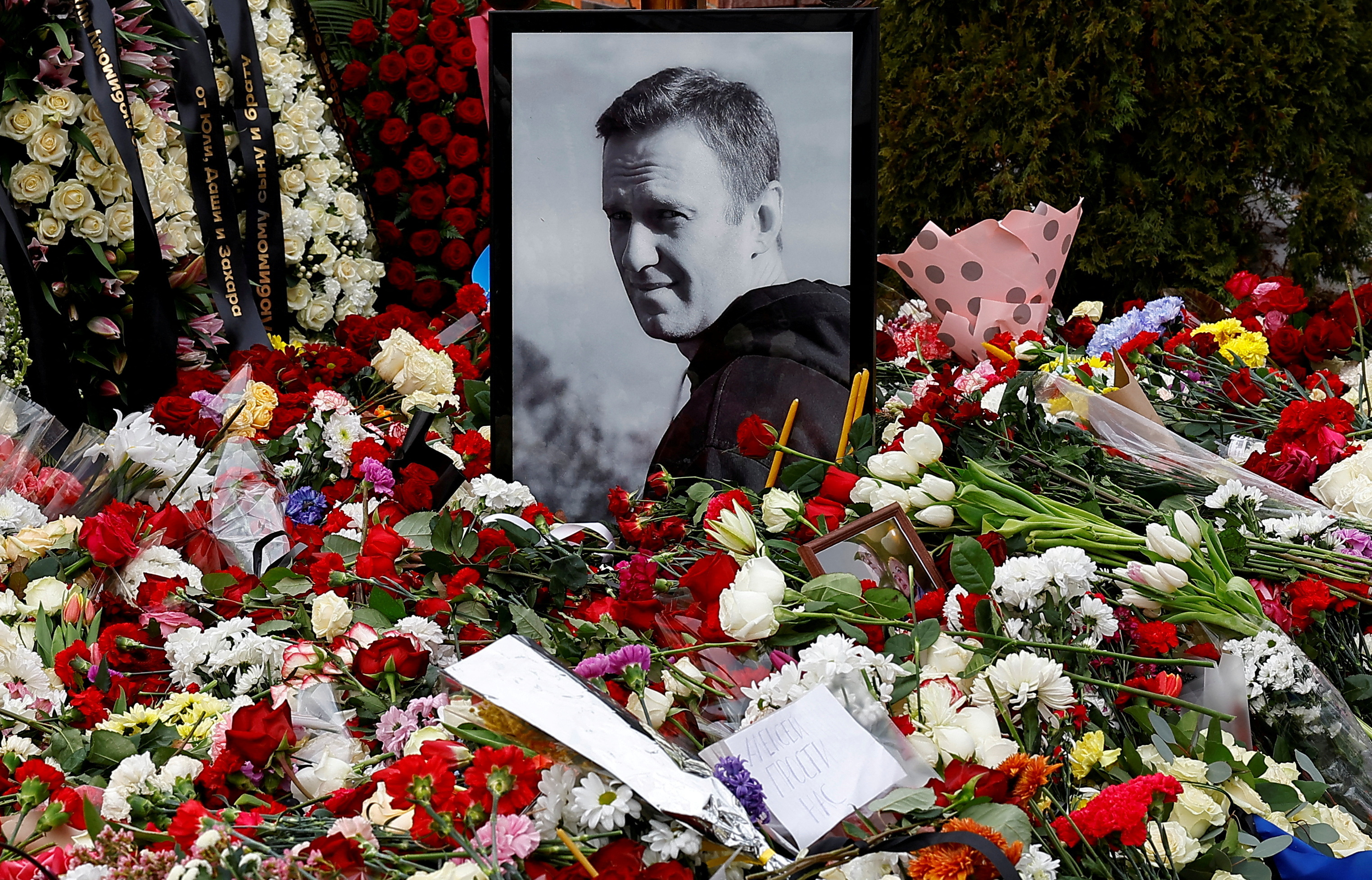 FILE PHOTO: Mourners come to grave of Russian opposition leader Alexei Navalny