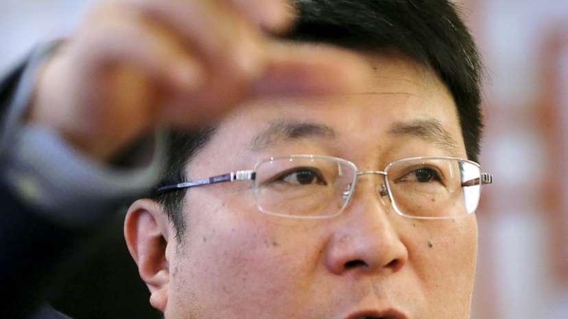 Tsinghua Unigroup's Chairman Zhao speaks at an interview with Reuters at his office in Beijing
