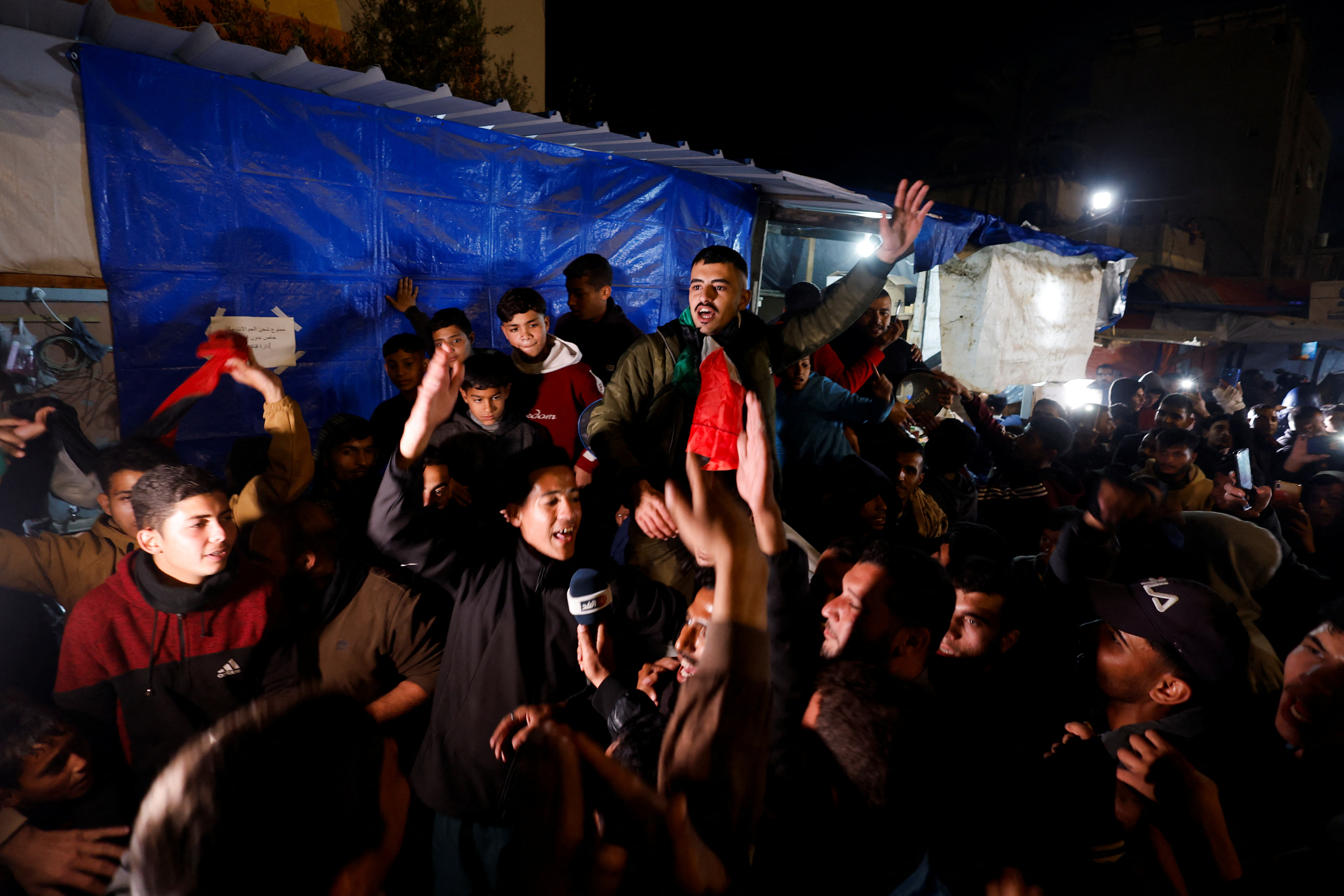Palestinians react to news on a ceasefire deal with Israel, in Khan Younis in the southern Gaza Strip
