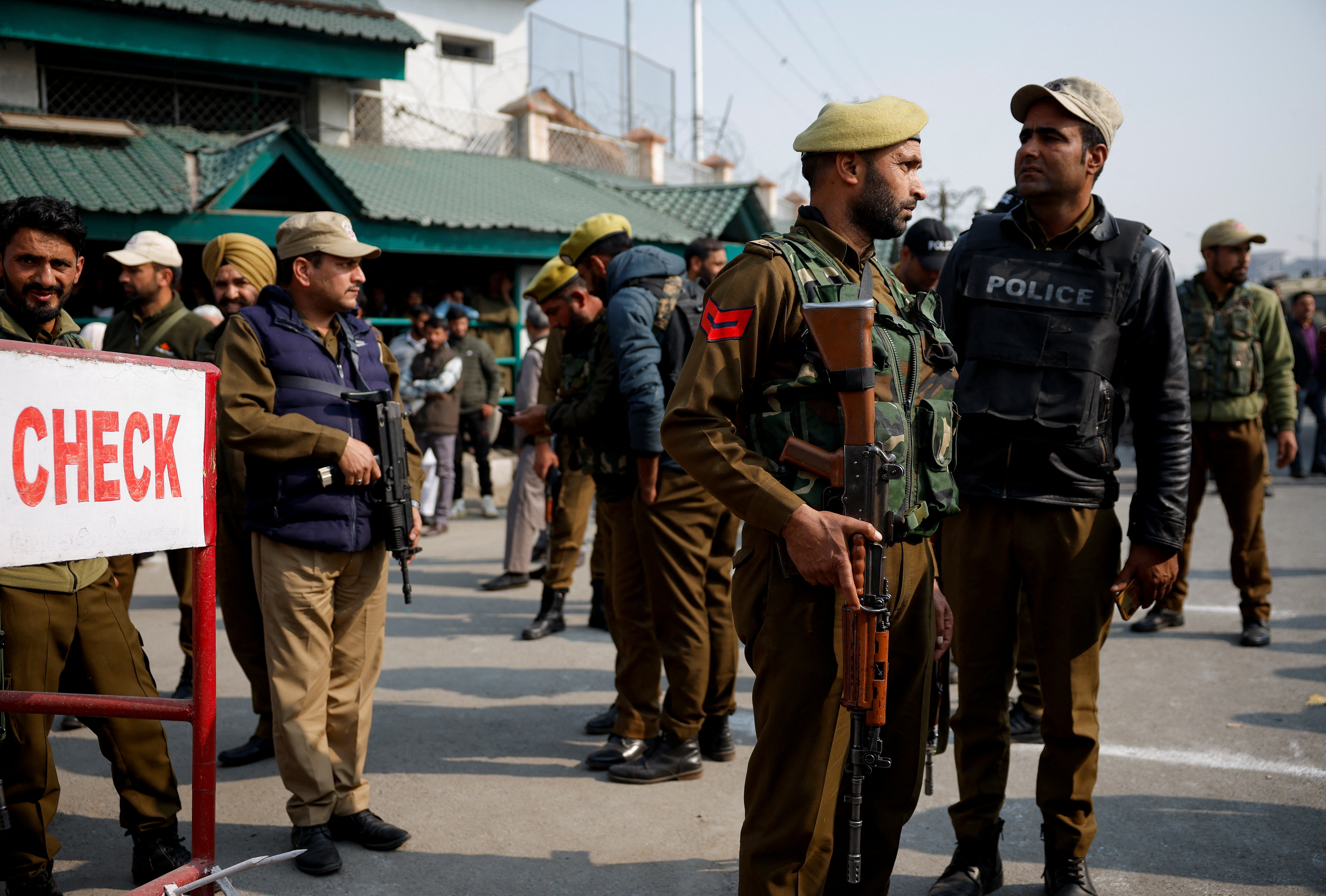 Indian security personnel stand guard outside the Jammu and Kashmir Assembly as it holds the first session amid a series of militant attacks in Srinagar