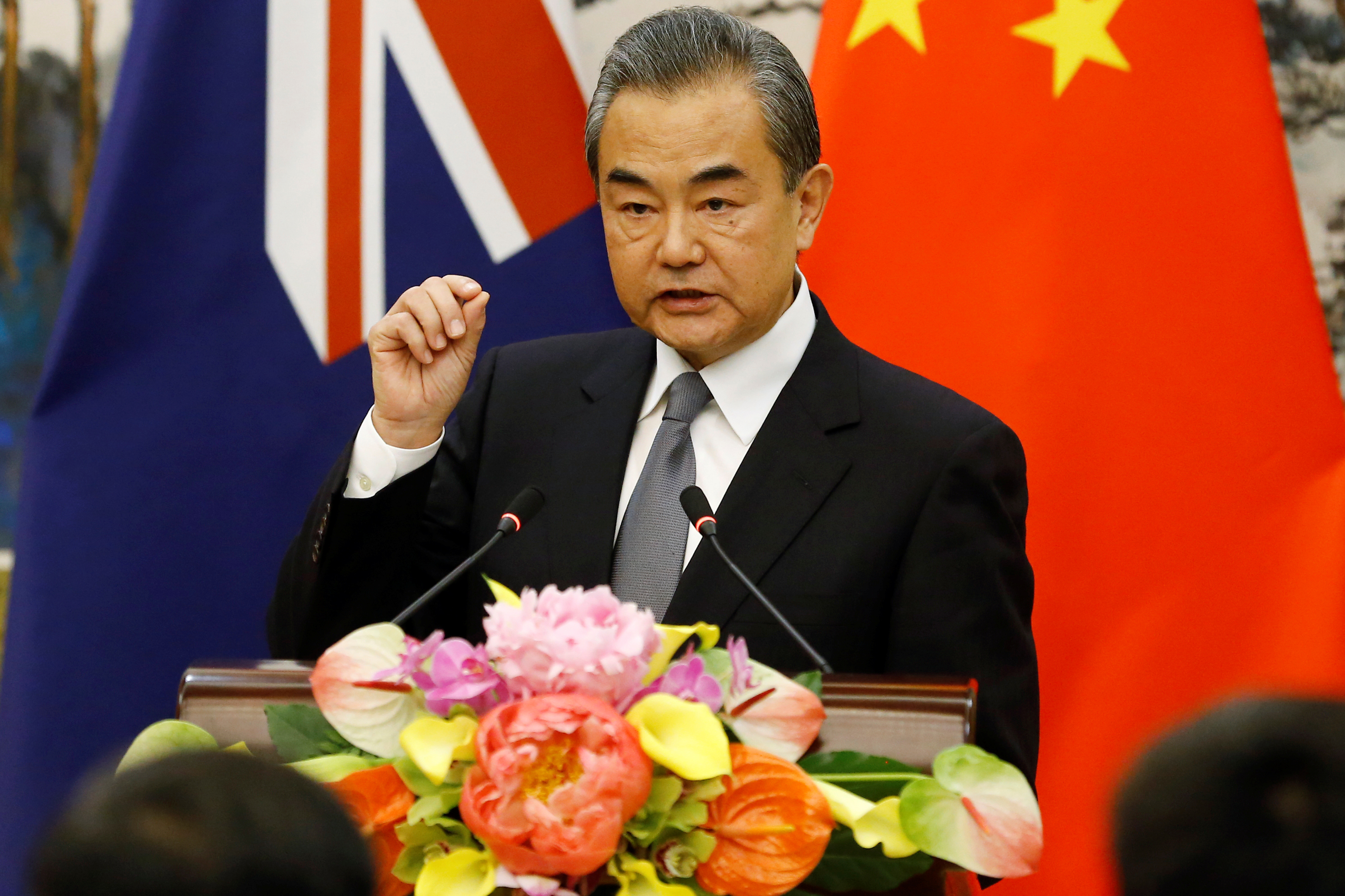 FILE PHOTO: Chinese Foreign Minister Wang Yi speaks at a news conference with Australian Foreign Minister Marise Payne at the Diaoyutai State Guesthouse in Beijing
