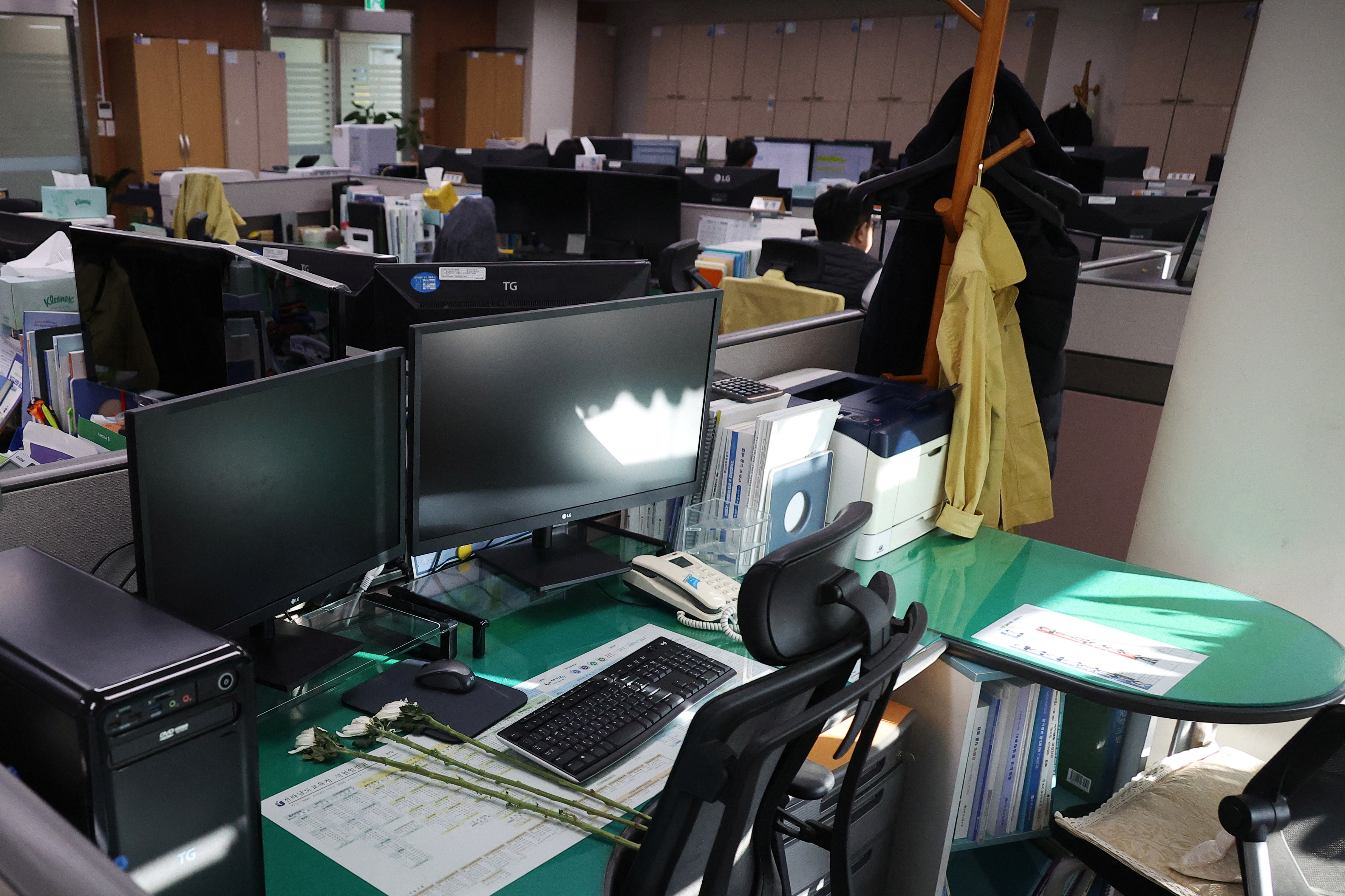 Condolence flowers are laid on the desk of a government official of Jeollanam-do Office of Education, who died in the Jeju Air crash at Muan International Airport, in Muan
