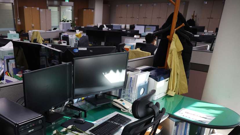 Condolence flowers are laid on the desk of a government official of Jeollanam-do Office of Education, who died in the Jeju Air crash at Muan International Airport, in Muan