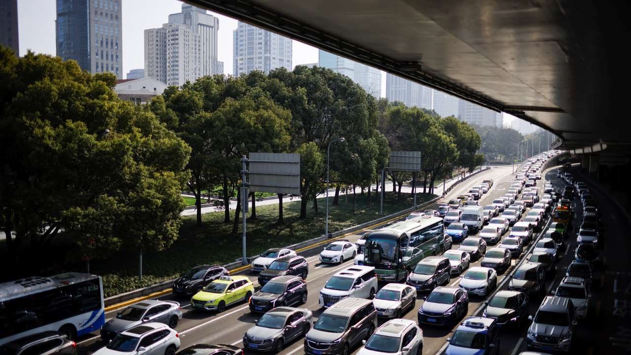 Cars wait in traffic in Shanghai